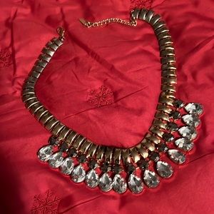 Gorgeous necklace,great quality.Gold color with gray and white rhinestones